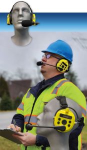 Worker holding clip board wearing hi-vis vest and hard hat with bright yellow communication headset. Headset modeled on head form at different angles to show helmet-compatible head band.
